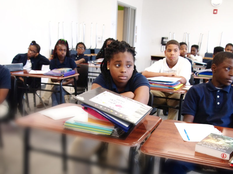 Students sitting at desks inside classroom