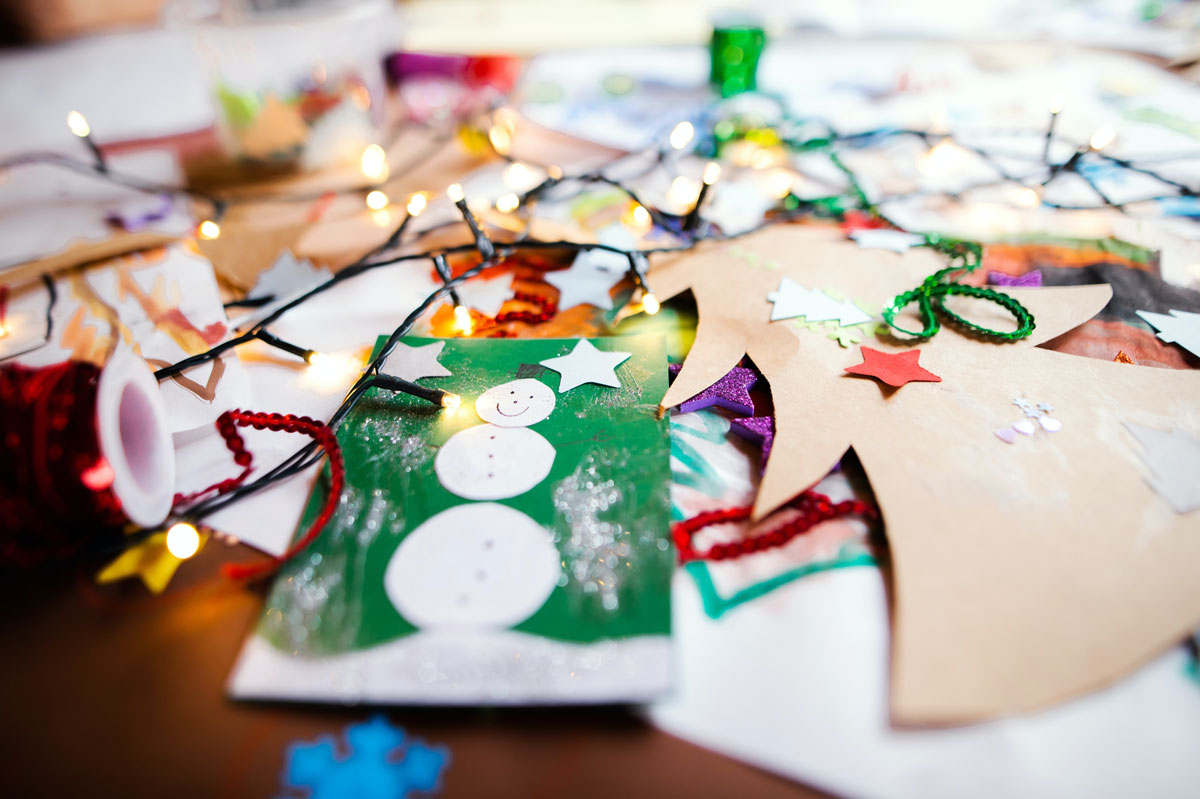 handmade holiday decorations scattered on a table