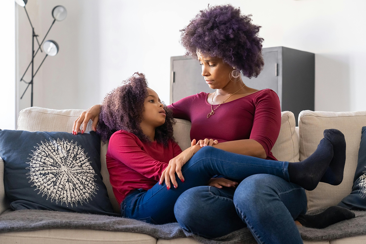 mother and young daughter having a serious conversation